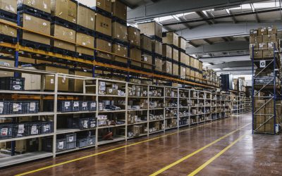 Rows of many shelves with cardboard boxes in storage room of huge distribution warehouse aisle in industrial storage factory background XXXL size