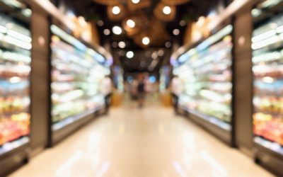 Grocery store shelves with fruits and vegetables blurred background