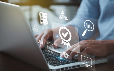Businessman working on laptops with signs of the top service Quality control certification checked guarantees of the standard of company product. Concept on virtual screen."n"n"n