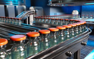 Vaccines in a pharmaceutical factory's production line are shown in a 3D rendering.