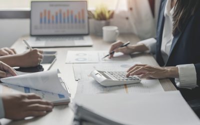 Cropped shot of diverse coworkers working together in boardroom, brainstorming, discussing and analyzing business strategy.
