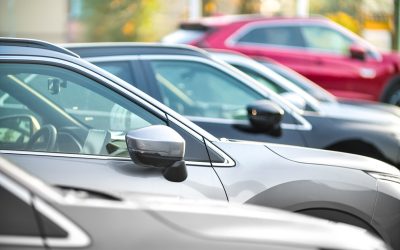 Side shot of a range of used modern vehicles, at a public car dealership