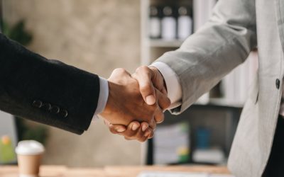 Two confident business man shaking hands during a meeting in the office, success, dealing, greeting and partner