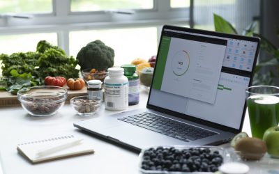 Professional Nutritionist workspace, surrounded by a variety of fruits, nuts, vegetables, and supplements on the table