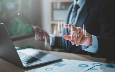 chart, document, graph, management, marketing, plan, report, result, statistic, accounting. A man is holding a tablet, and he is looking at a graph. Concept of a businessman working on his computer.